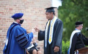 Barton College President Doug Searcy congratulates Barton Graduate