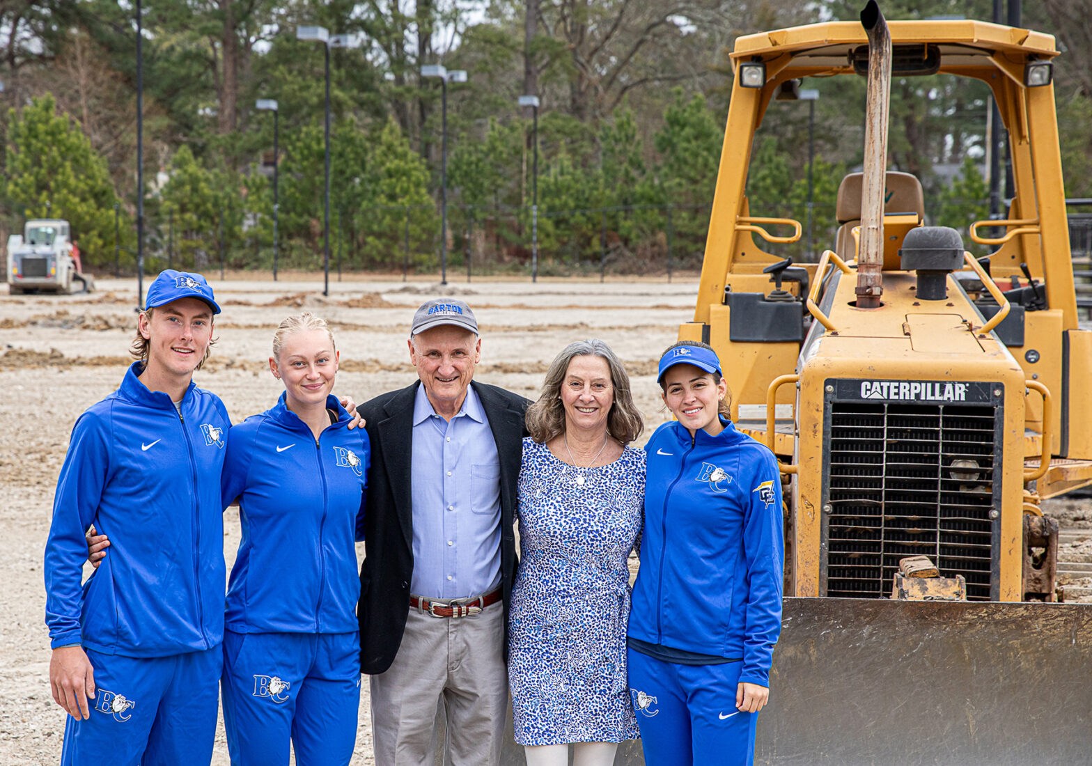 Daniel and Paula Michalak with Barton Tennis players at site for new Michalak Tennis Center